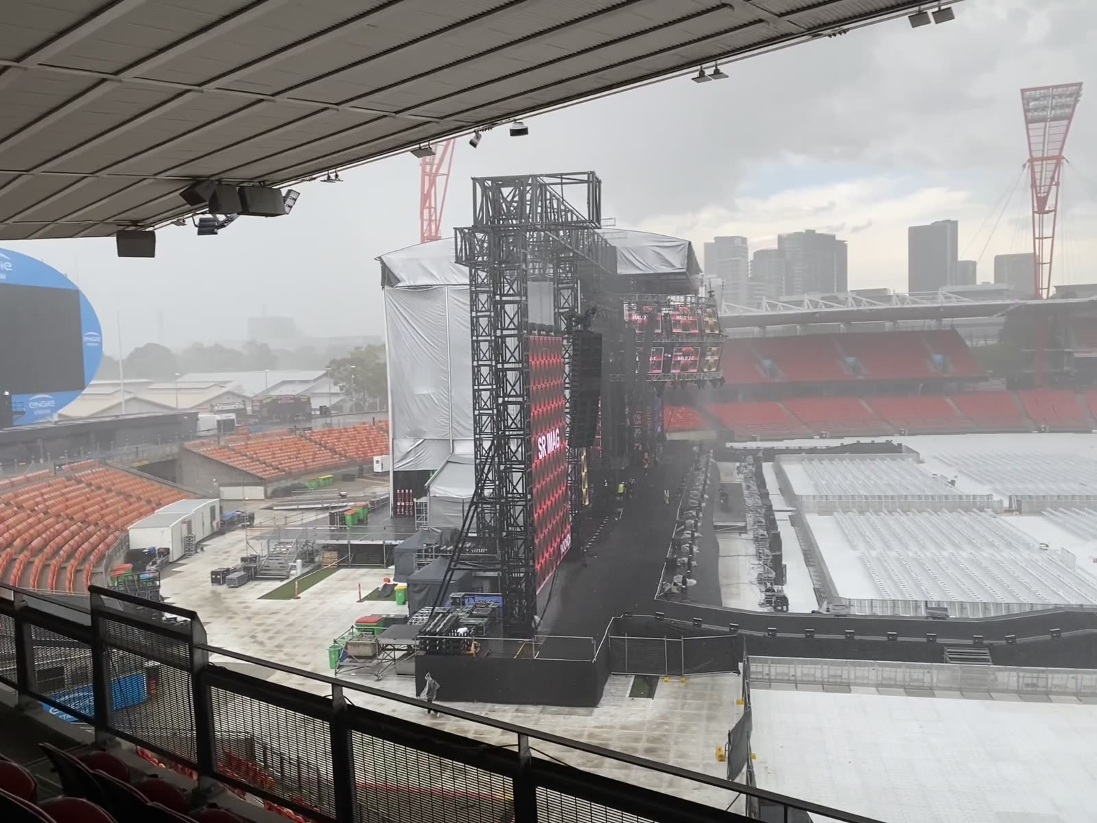 Stadium build, daytime, floor covered