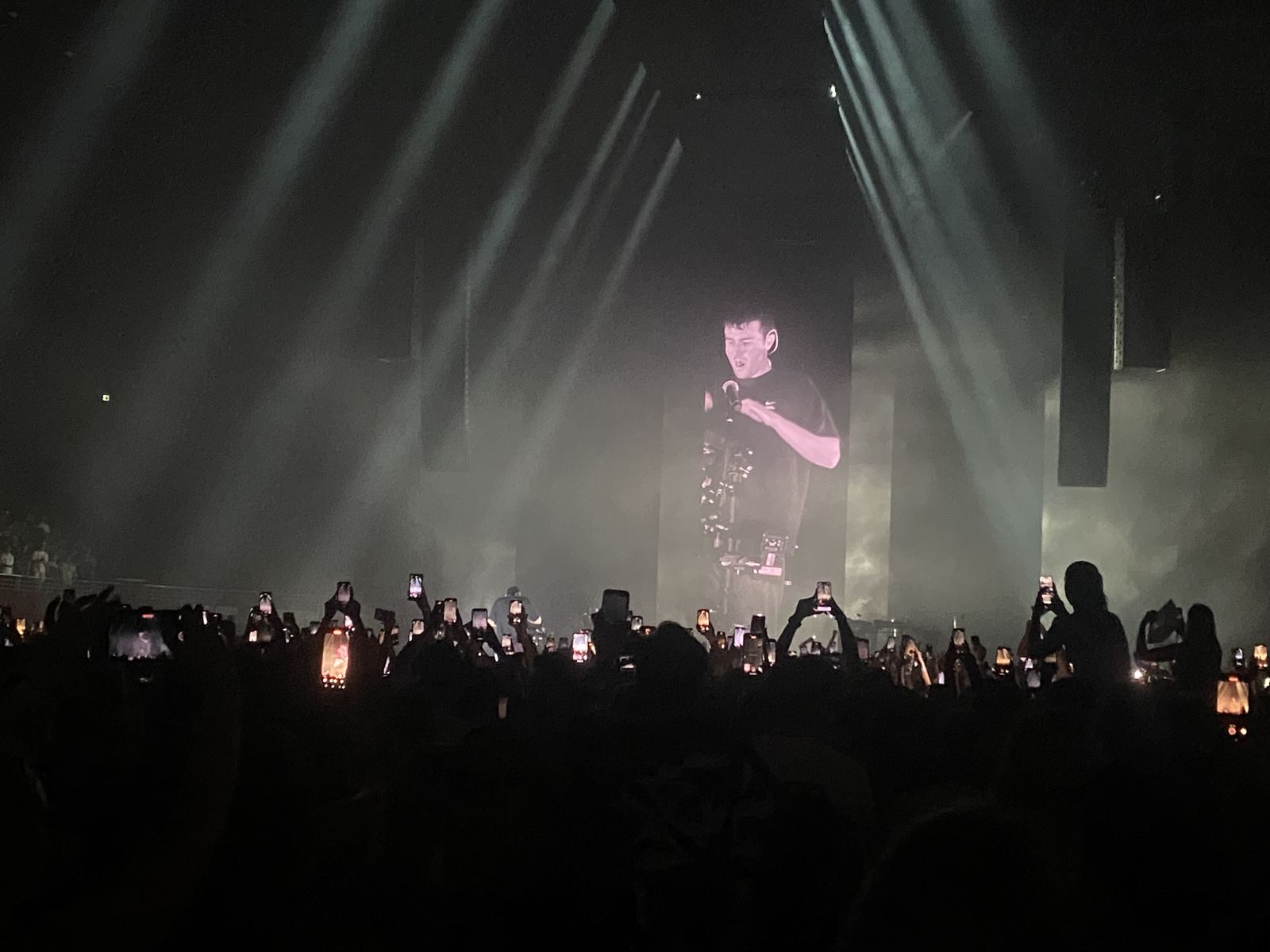 Arena crowd with phones up at a Fred again.. show